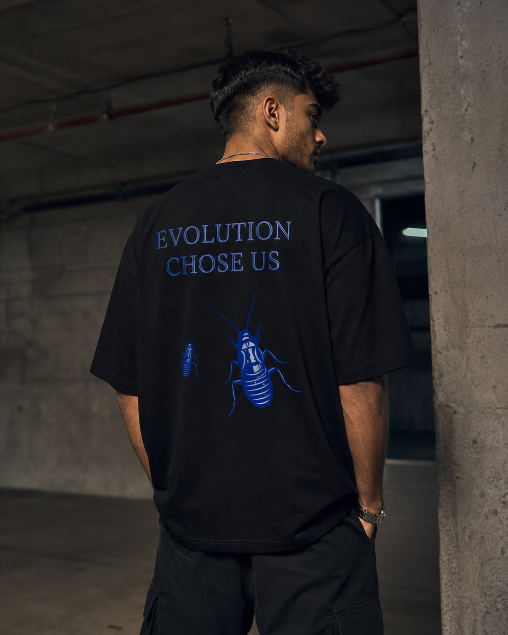 Black Cockroach Evolution Chose Us Premium Oversized T-Shirt back view with blue cockroach evolution graphic artwork and Evolution Chose Us typography