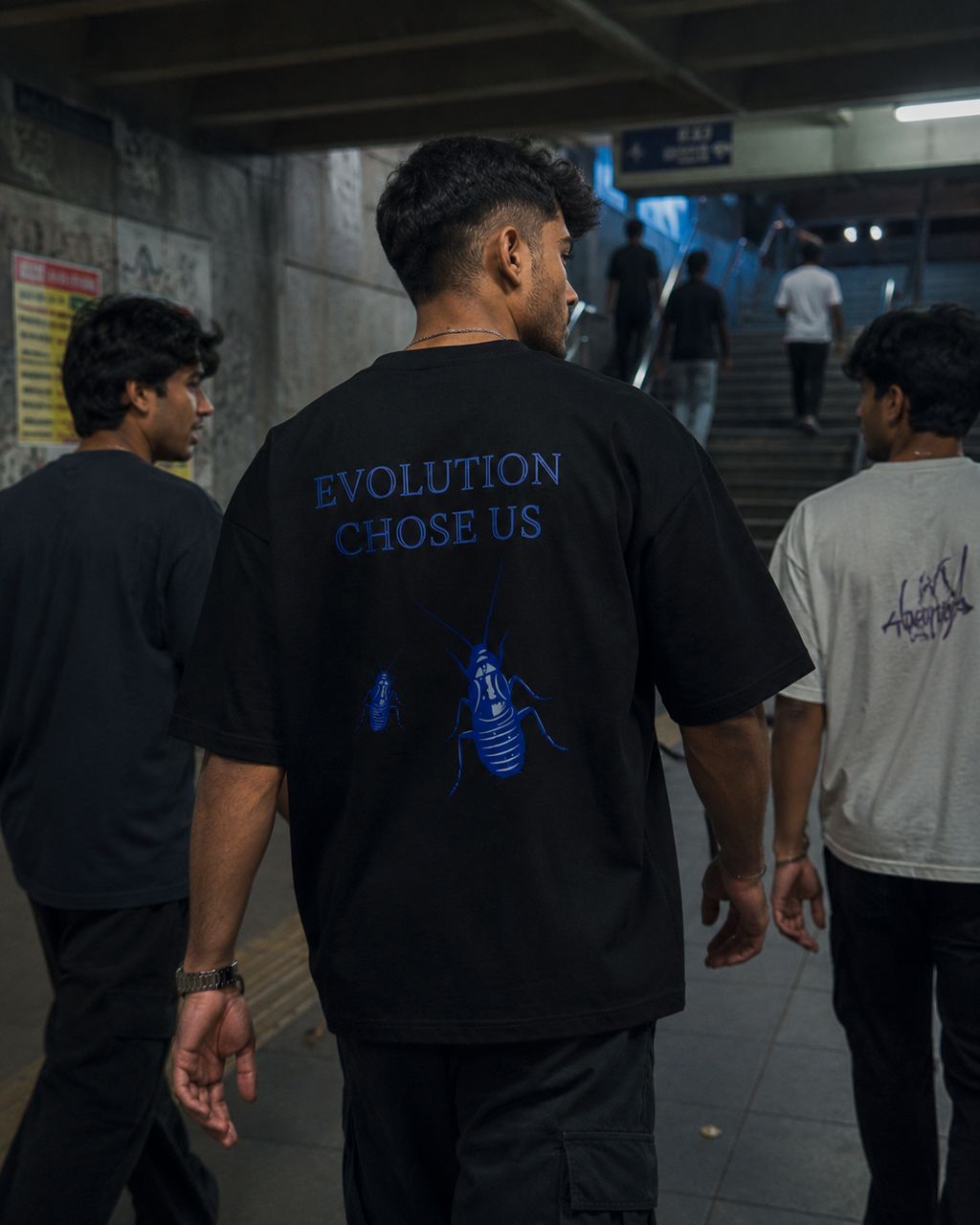 Black Cockroach Evolution Chose Us Premium Oversized T-Shirt in urban streetwear lifestyle setting with blue cockroach evolution artwork