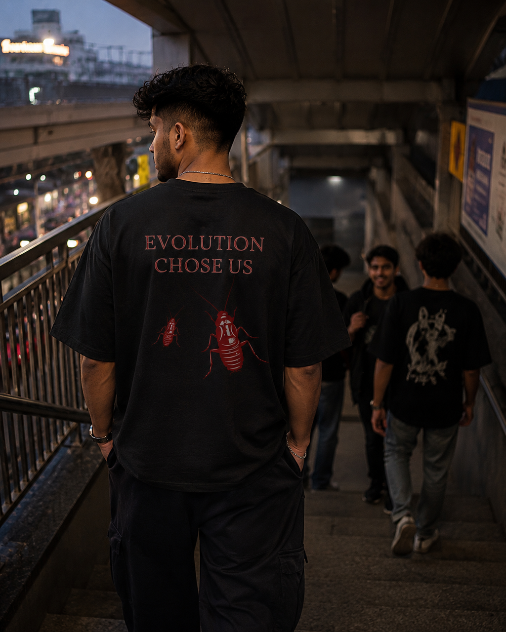 Black Cockroach Evolution Chose Us Premium Oversized T-Shirt in urban streetwear lifestyle setting with red cockroach evolution artwork