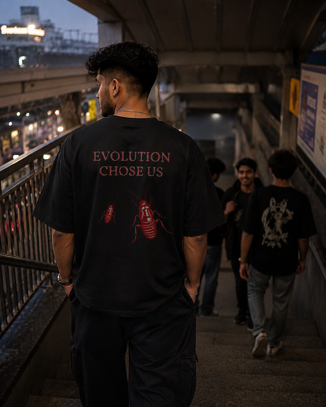 Black Cockroach Evolution Chose Us Premium Oversized T-Shirt in urban streetwear lifestyle setting with red cockroach evolution artwork