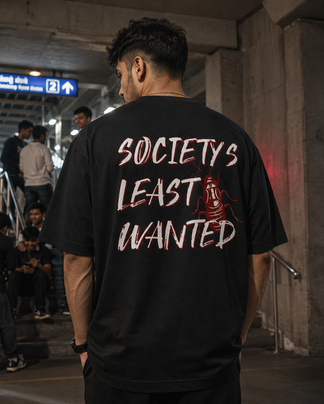 Black Cockroach Society's Least Wanted Premium Oversized T-Shirt back view with red cockroach graphic and Society's Least Wanted typography