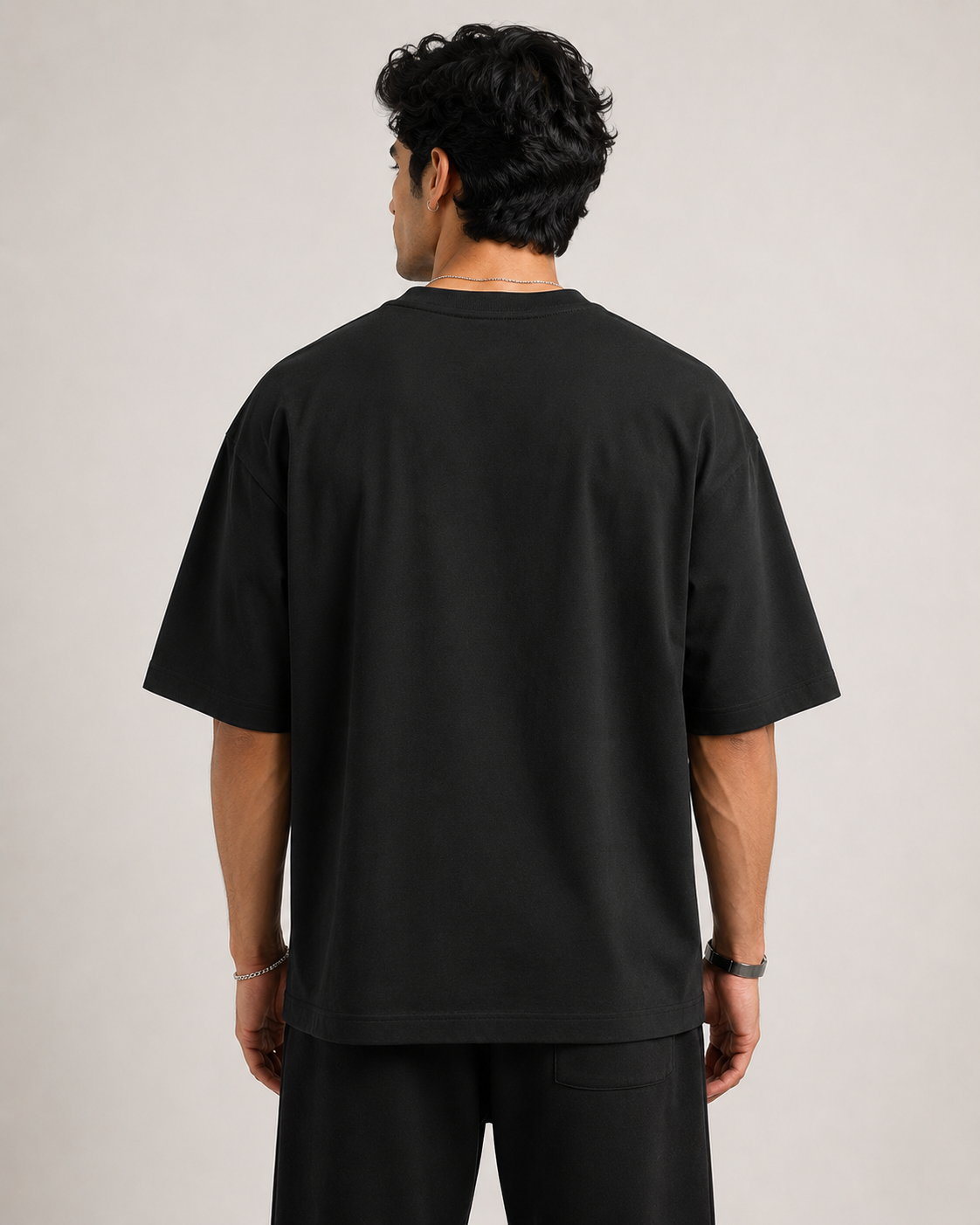 Black Drip Earth oversized t-shirt - rear model studio view with clean silhouette