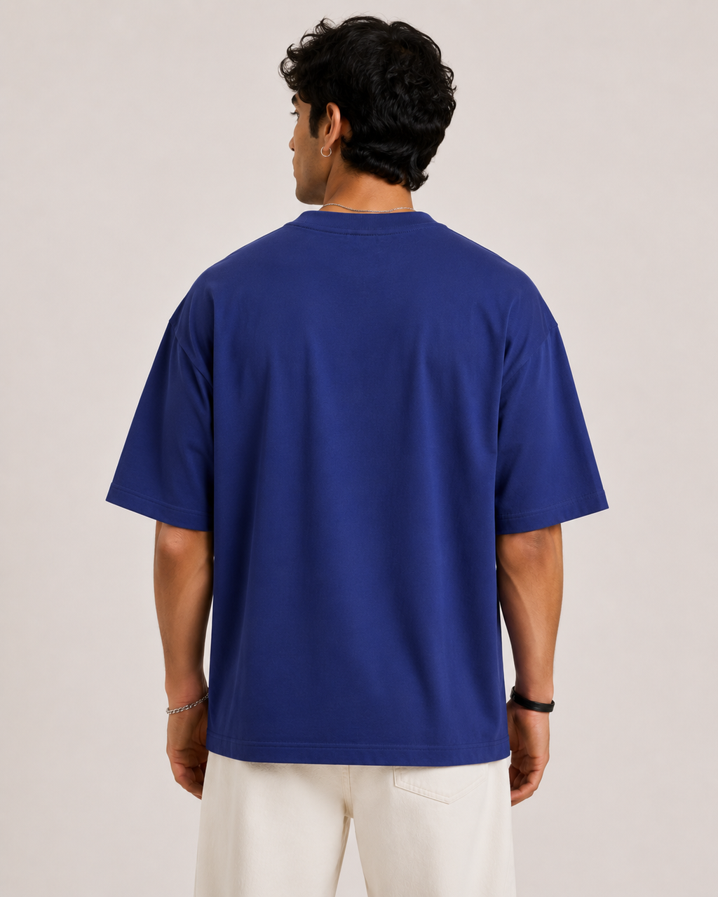Royal-Blue Drip Earth oversized t-shirt - rear model studio view with clean silhouette