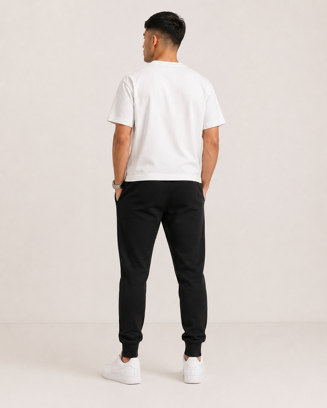 Black Drip Earth tapered joggers - rear model studio view with clean silhouette