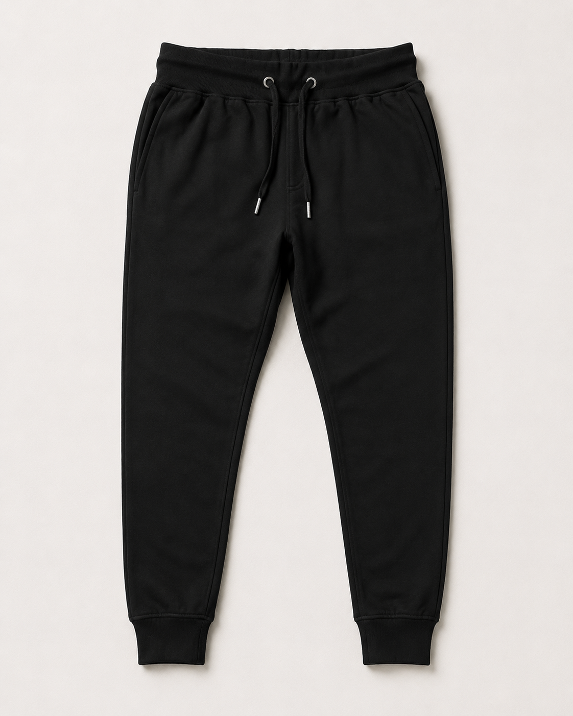 Black Drip Earth tapered joggers with LINE STATE silhouette - folded front and back view