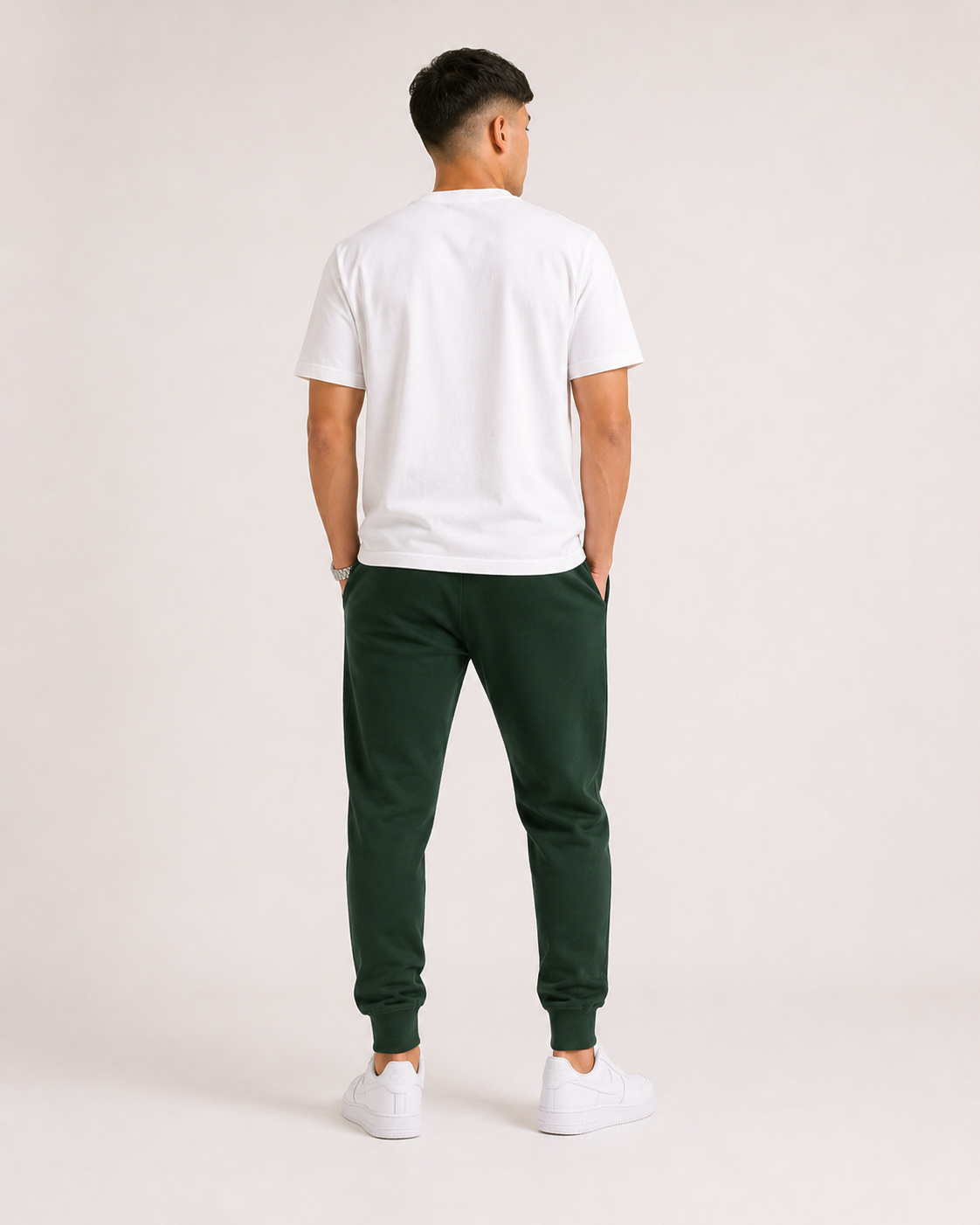 Bottle-Green Drip Earth tapered joggers - rear model studio view with clean silhouette