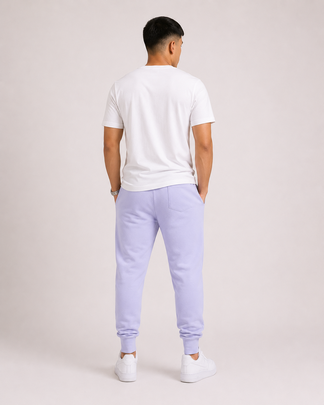 Lavender Drip Earth tapered joggers - rear model studio view with clean silhouette