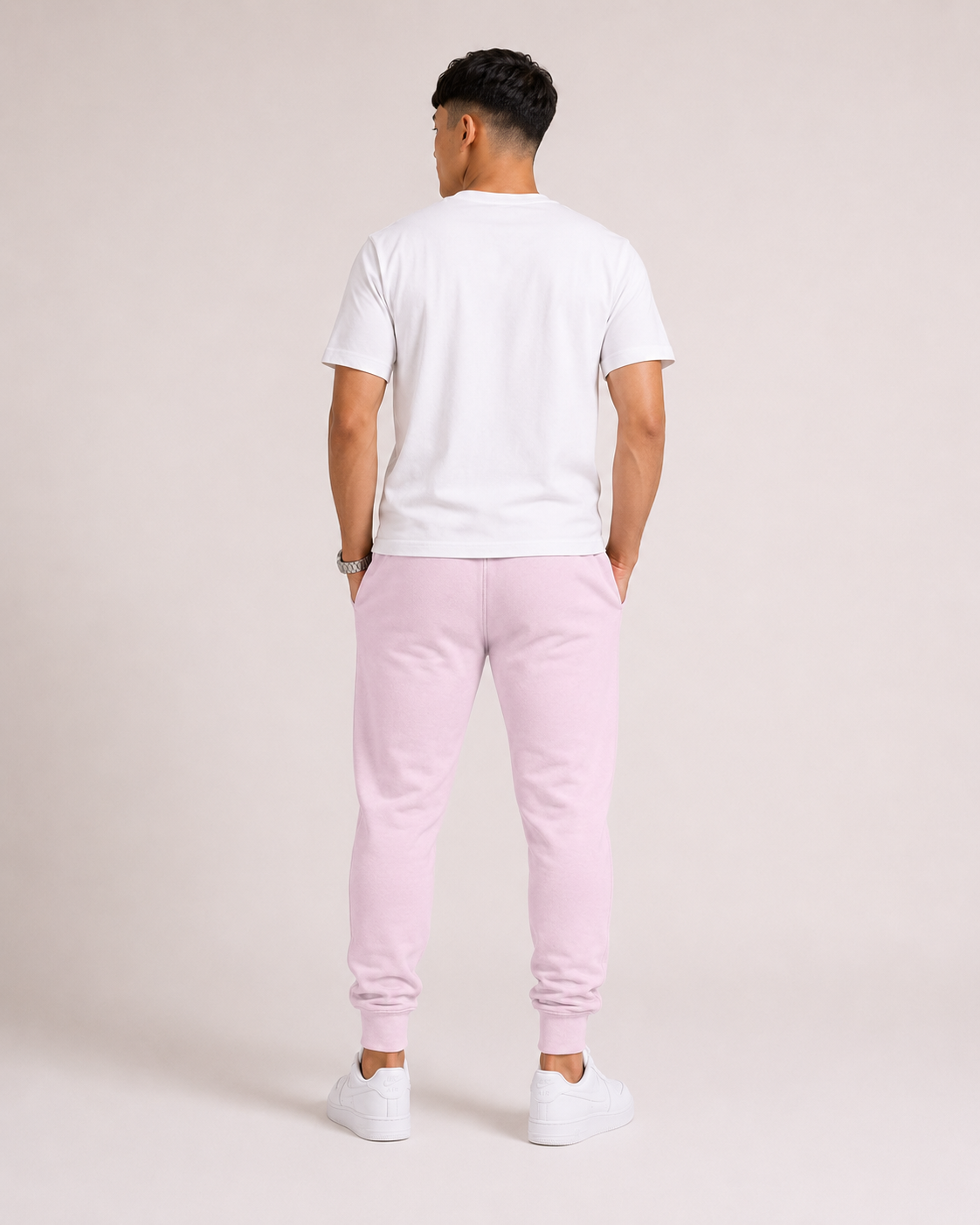 Light-Baby-Pink Drip Earth tapered joggers - rear model studio view with clean silhouette
