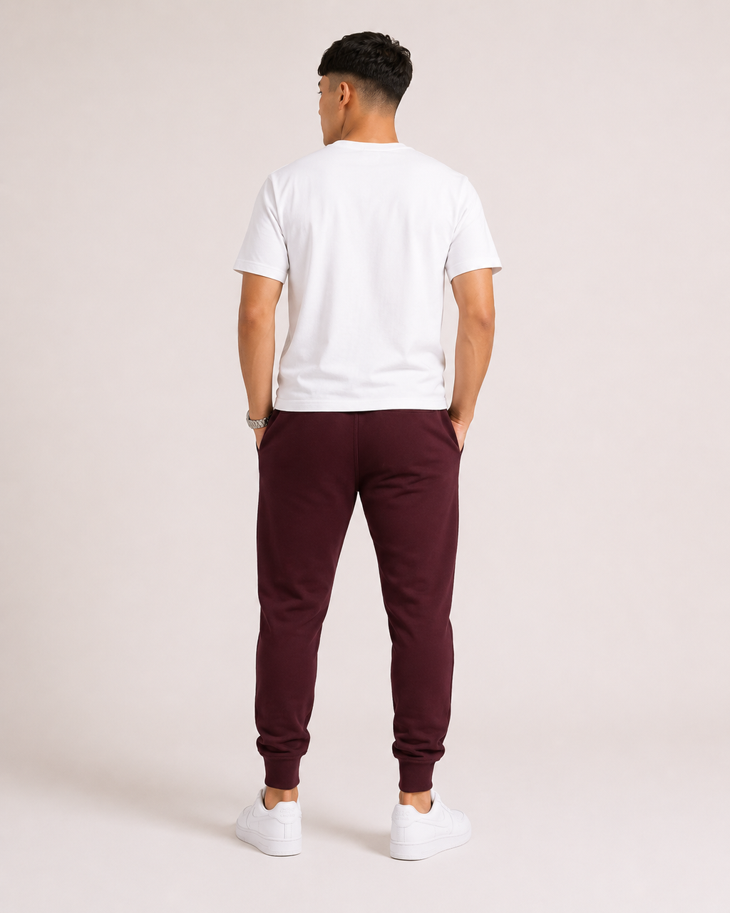 Maroon Drip Earth tapered joggers - rear model studio view with clean silhouette