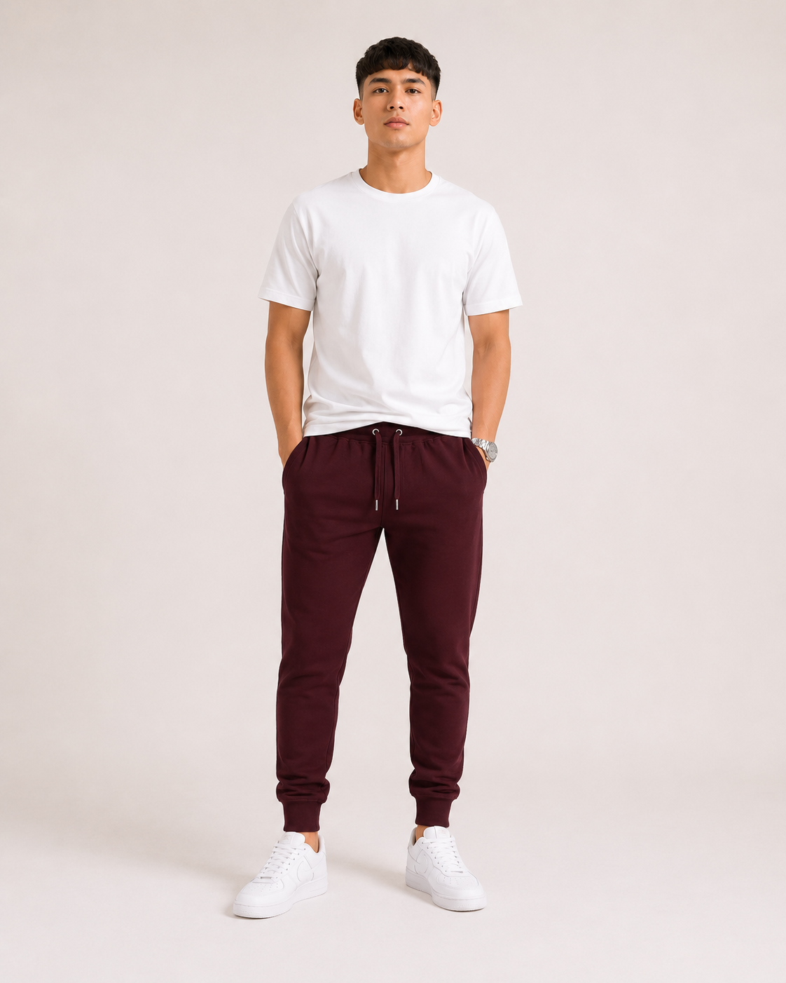 Maroon Drip Earth tapered joggers - front model studio view with premium fit