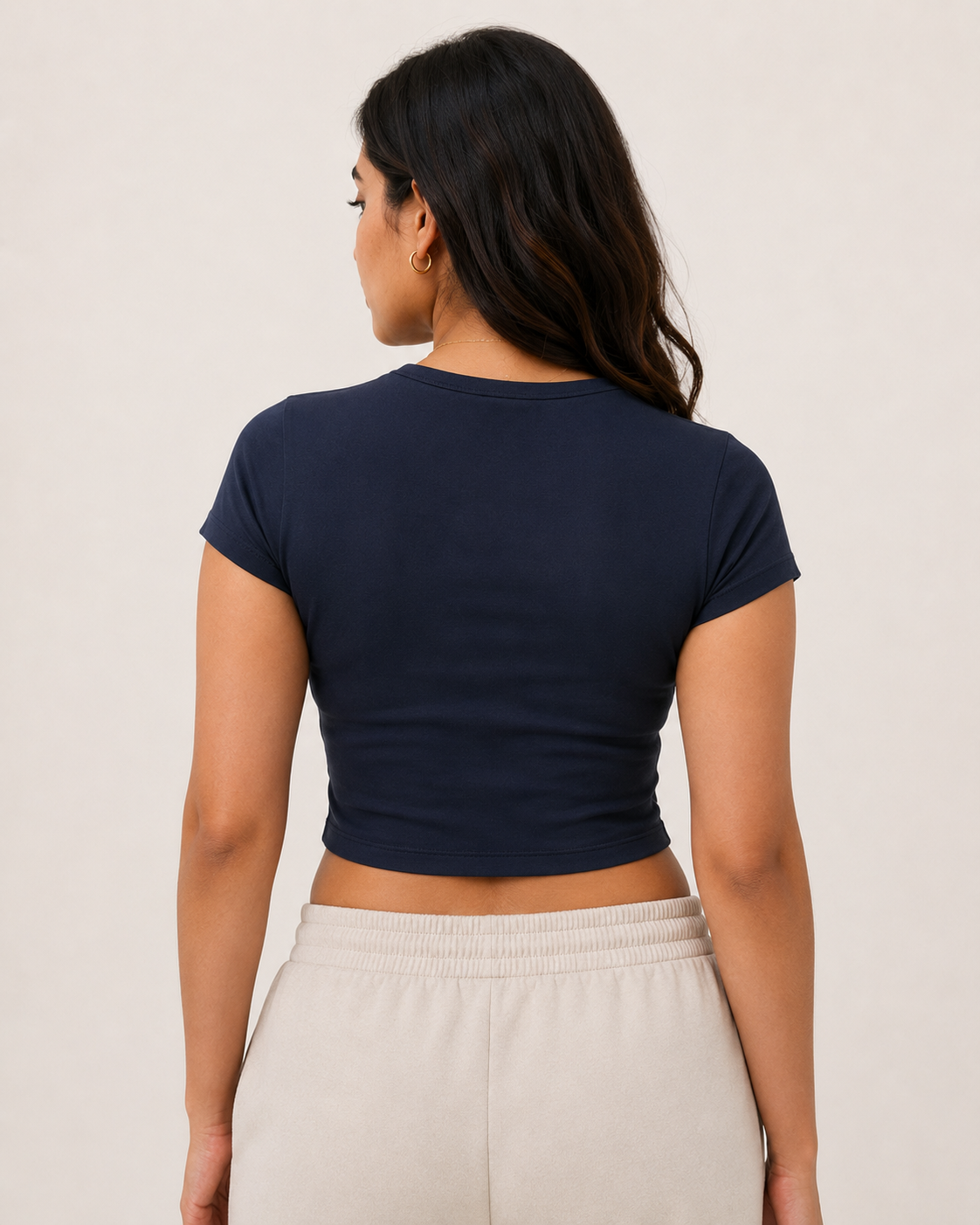 Navy-Blue Drip Earth baby tee - rear model studio view with clean silhouette