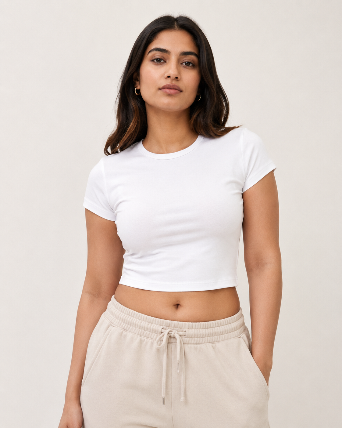 White Drip Earth baby tee - front model studio view with premium fit