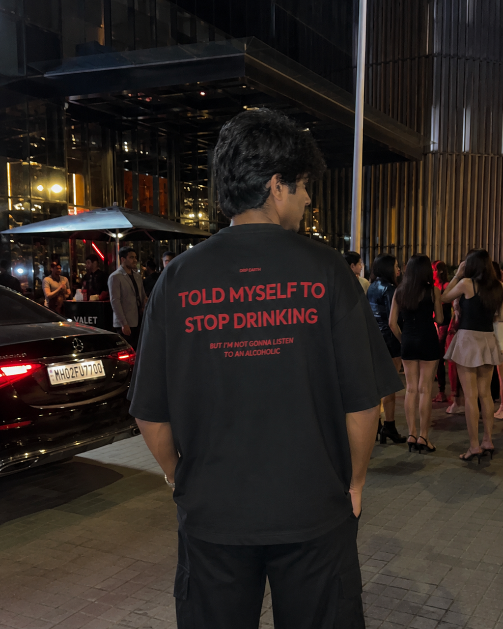 Black Drip Earth oversized heavyweight t-shirt with STOP DRINKING back graphic - rear model view