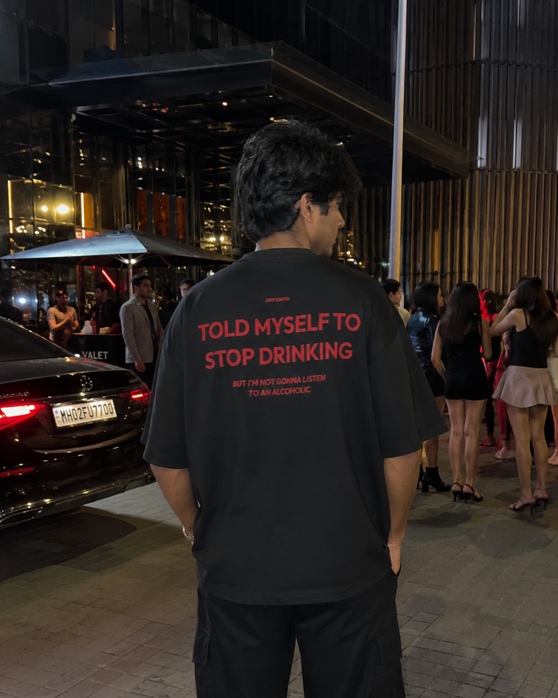 Black Drip Earth oversized heavyweight t-shirt with STOP DRINKING back graphic - rear model view