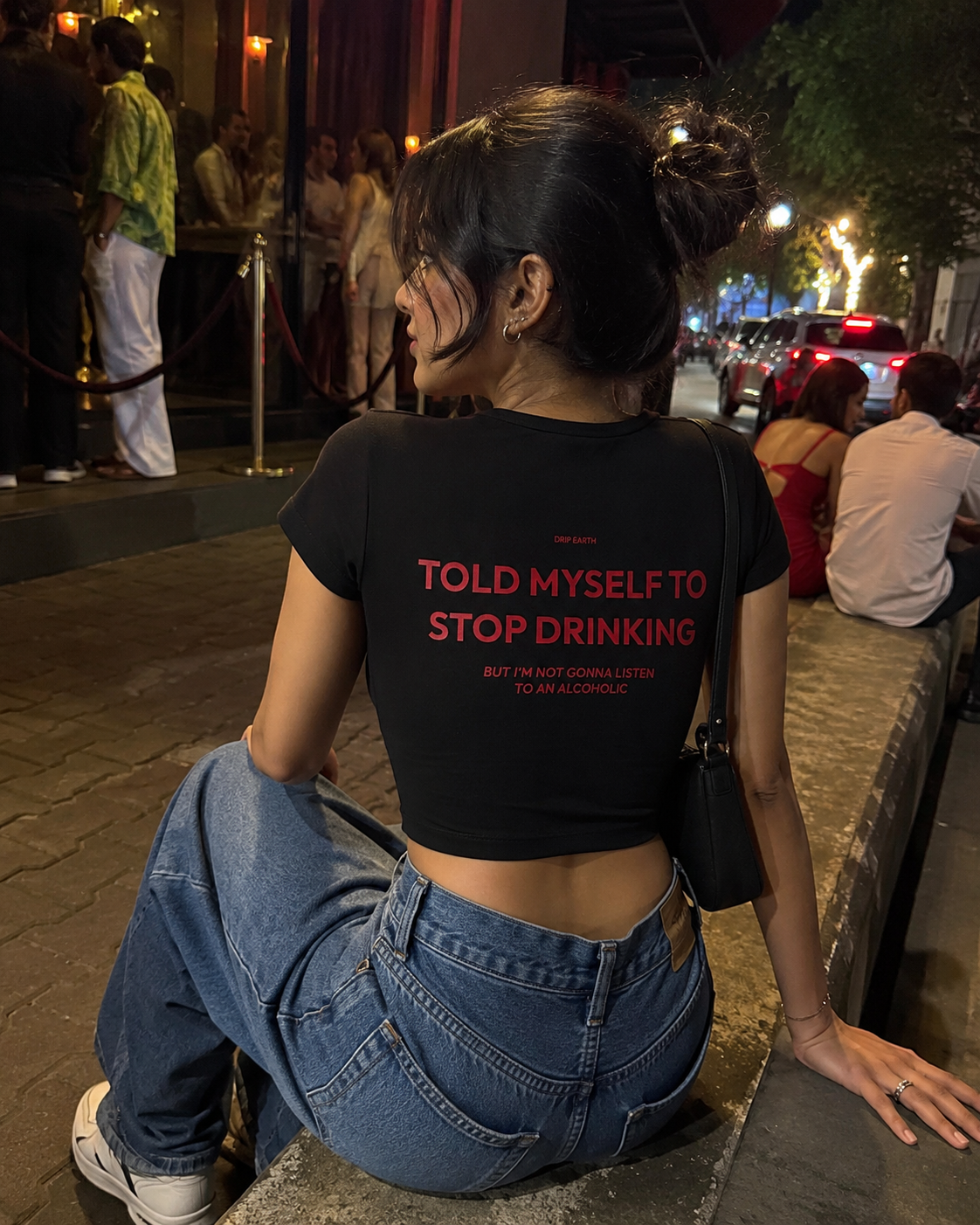 Black Drip Earth oversized heavyweight t-shirt with STOP DRINKING graphic - lifestyle streetwear shot