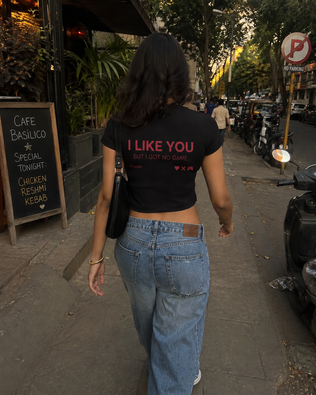 Black Drip Earth female baby tee with UNFILTERED NO GAME back graphic - rear model view
