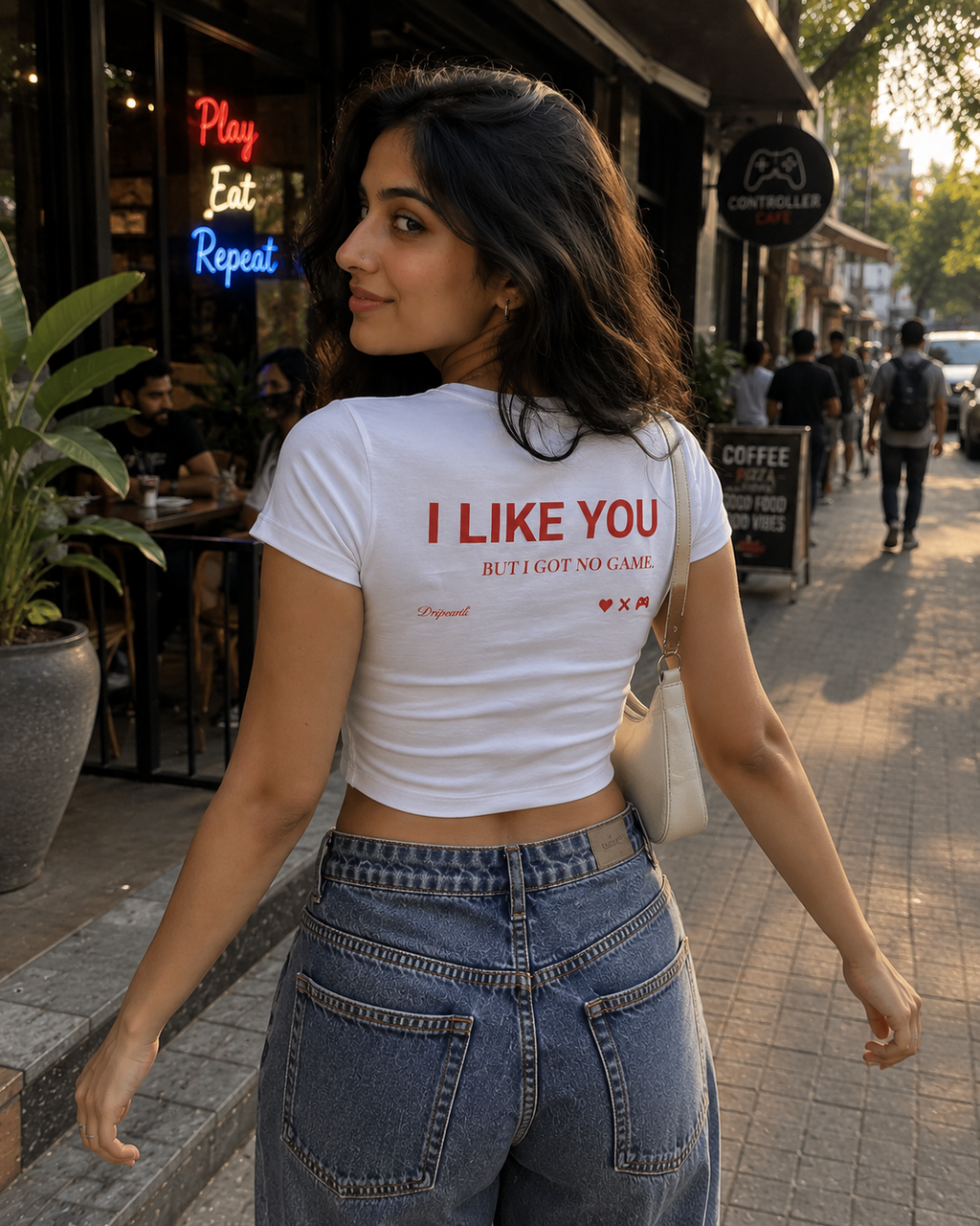 White Drip Earth female baby tee with UNFILTERED NO GAME graphic - lifestyle streetwear shot
