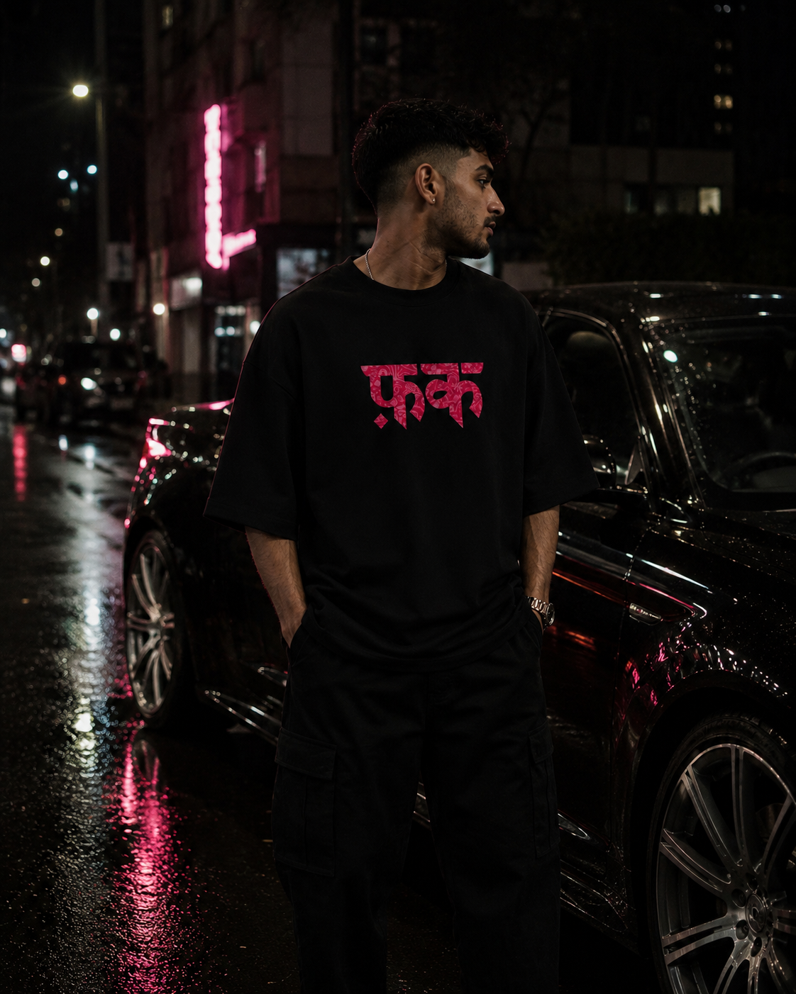 Black FK Energy Premium Oversized T-Shirt in premium urban streetwear lifestyle setting with FK graphic design
