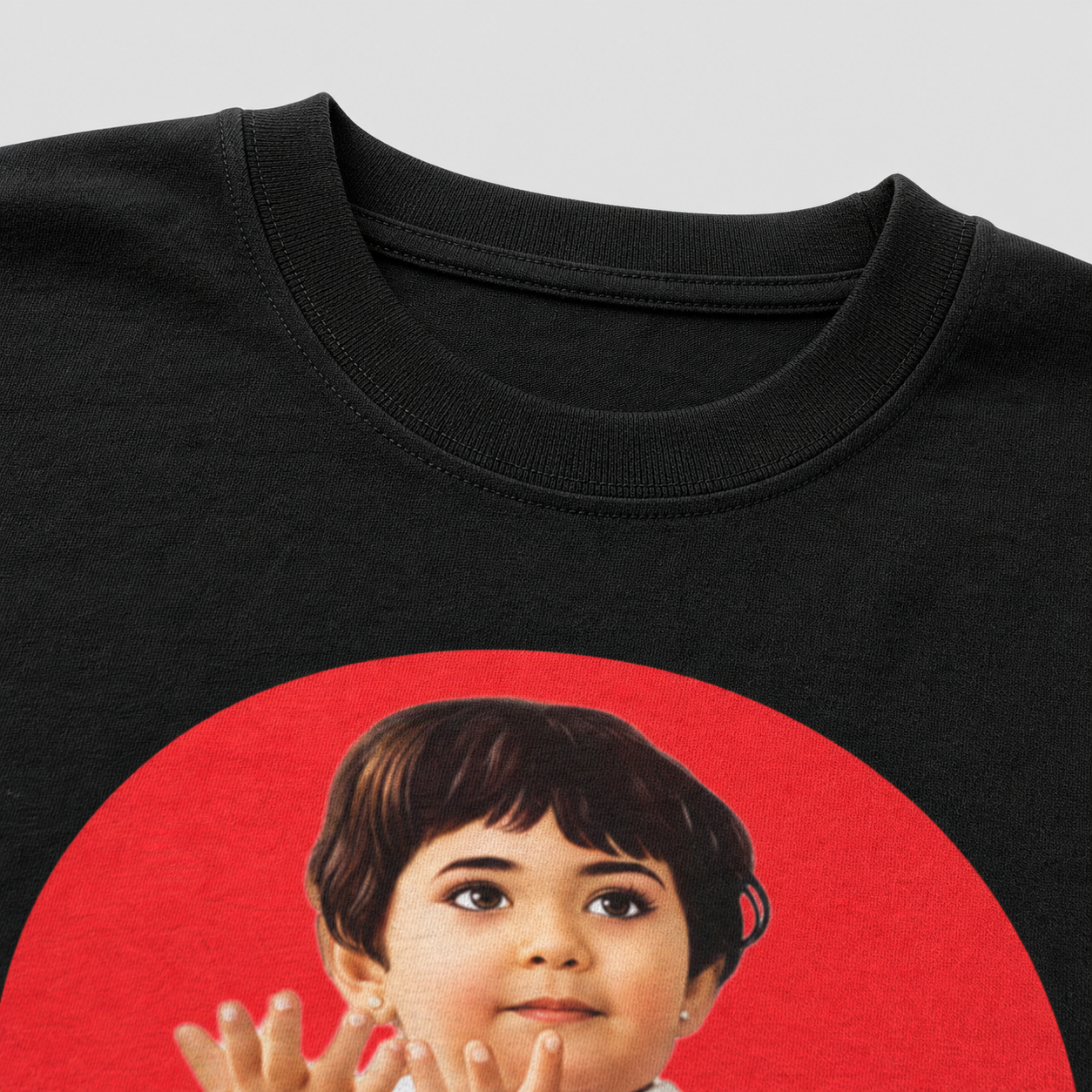 Black t-shirt with a red circle featuring a parle g girl on a gray background