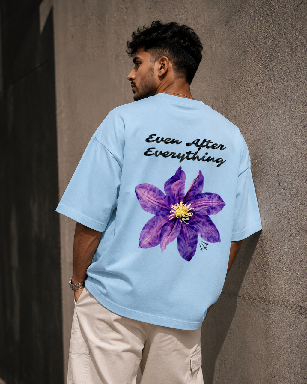 Baby-Blue Still Blooming Premium Oversized T-Shirt back view with Ever After Everything floral artwork