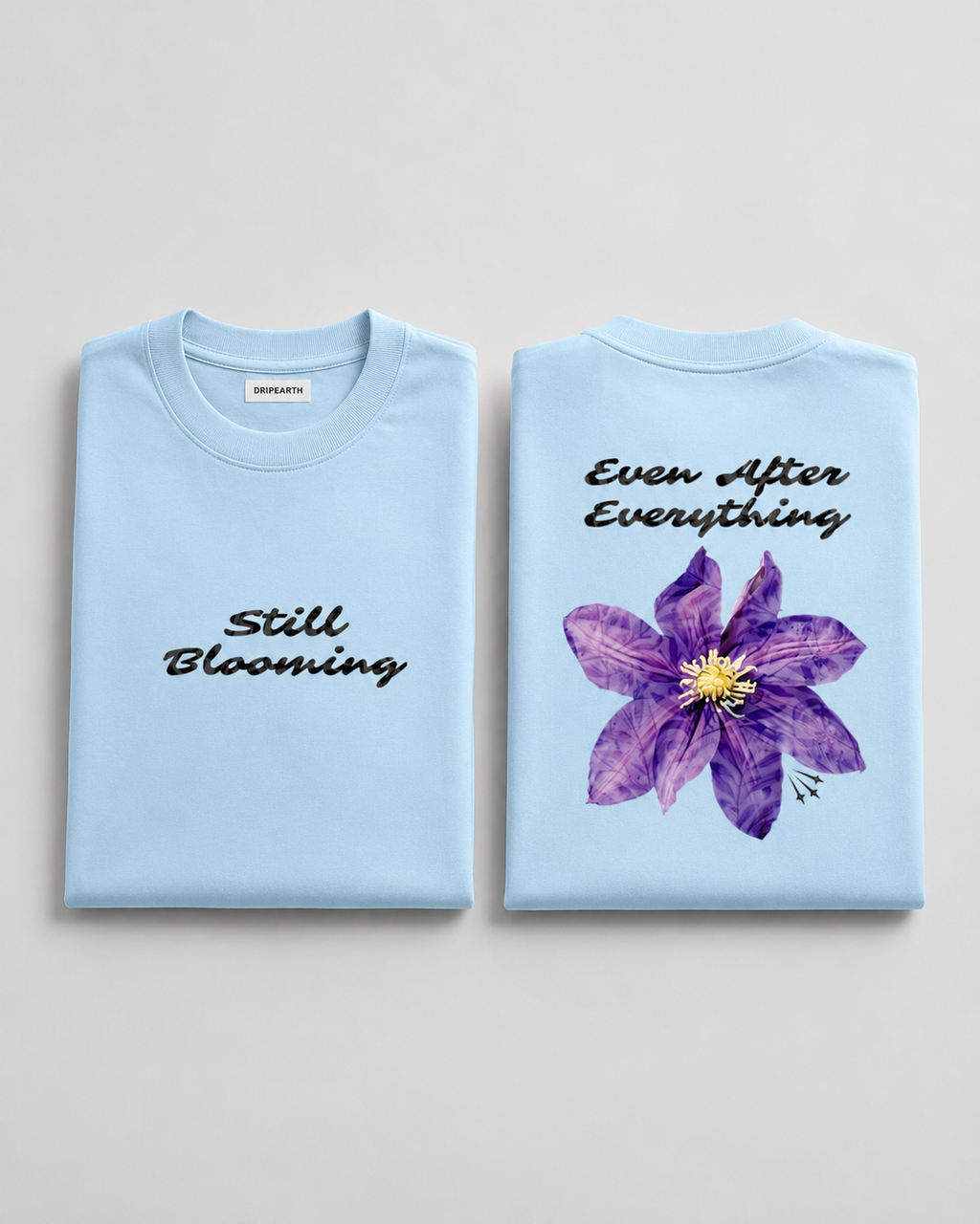 Baby-Blue Still Blooming Premium Oversized T-Shirt hero product view with front and back presentation