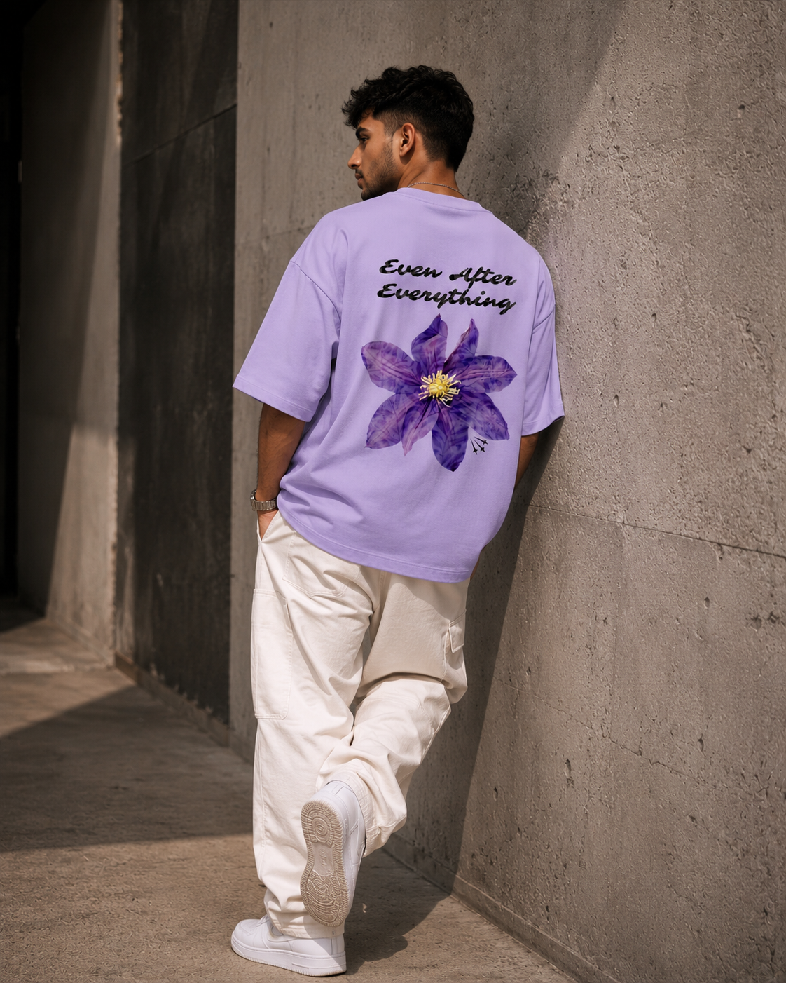 Lavender Still Blooming Premium Oversized T-Shirt in premium urban streetwear lifestyle setting with floral graphic design